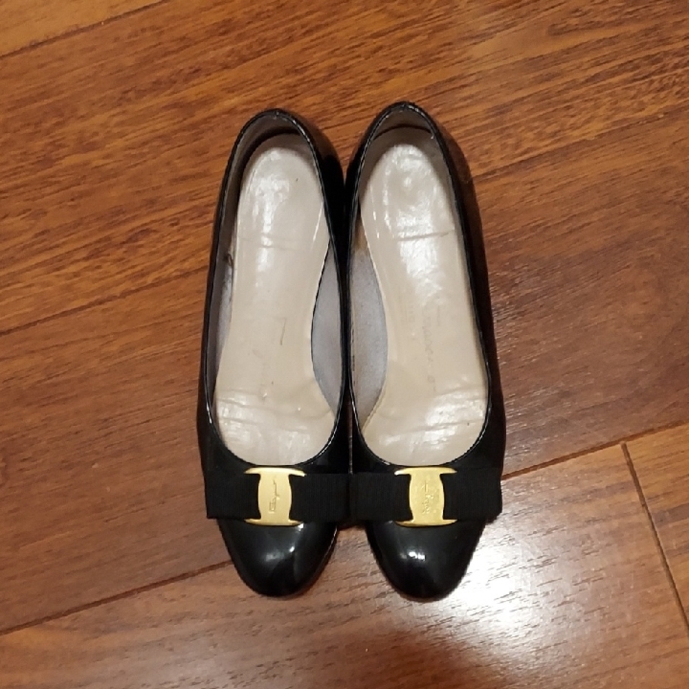 Salvatore Ferragamo Black and Gold Flats with Decorative Bow